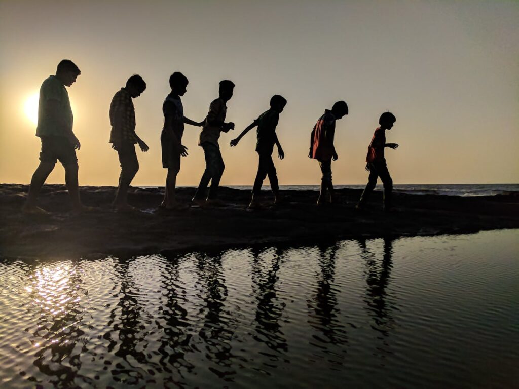 silhouettes walking in a sunset