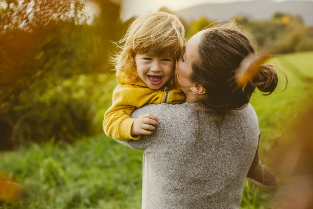 son and mother hugging